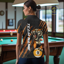 Load image into Gallery viewer, Back view of a female model wearing a polo shirt with roaring tiger artwork, orange claw marks, and billiard balls.