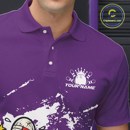 Close-up view of left chest area of a purple and white polo shirt, showing small detailed boxing bowling ball and pin graphic.