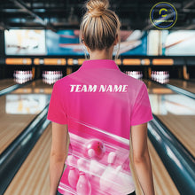 Load image into Gallery viewer, Female model back view in a bowling lane wearing a pink quarter zip shirt with bowling ball and pins over a pink geometric pattern.