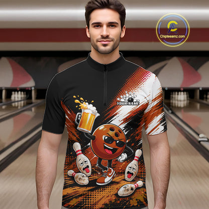 A man wearing a black short-sleeve quarter-zip performance shirt with a bowling-themed graphic print featuring a cartoon bowling ball, pins, and bowling pins, set against a blurred bowling alley background.