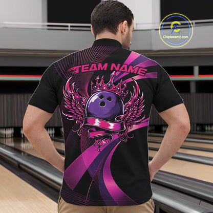 Person wearing a black bowling shirt with a purple and pink design on the back, standing in a bowling alley.