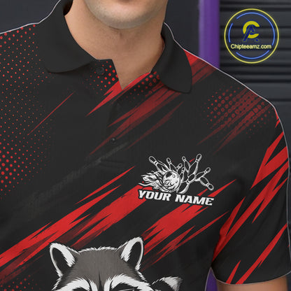 A close-up of a black short-sleeve polo shirt with red graphic stripes, a white raccoon illustration, and a customizable name patch on the chest. 