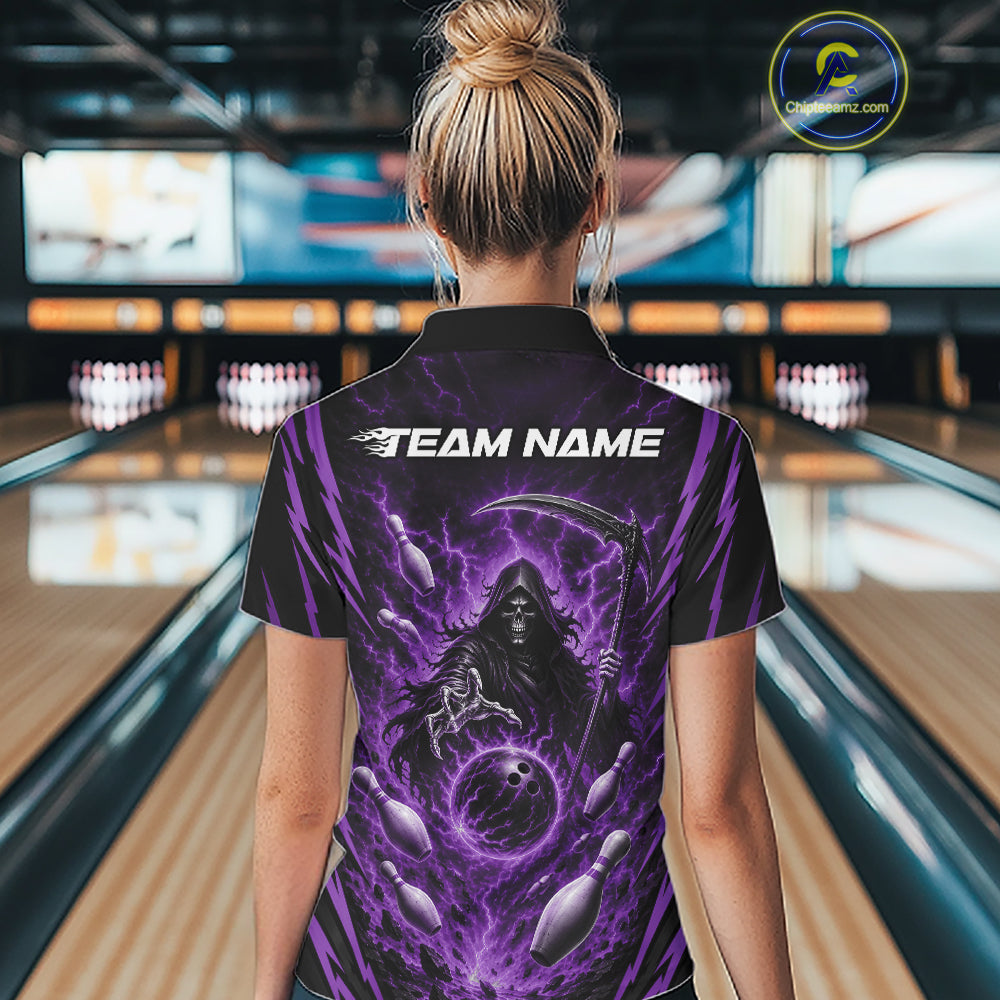 A woman viewed from behind wearing a black short-sleeve quarter zip bowling shirt with a large purple grim reaper graphic and the text 'TEAM NAME' on the back, standing in a bowling alley.