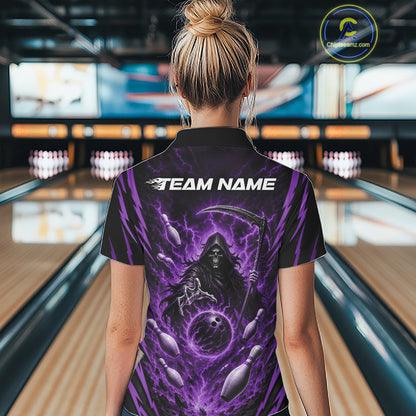 A woman viewed from behind wearing a black short-sleeve quarter zip bowling shirt with a large purple grim reaper graphic and the text 'TEAM NAME' on the back, standing in a bowling alley.
