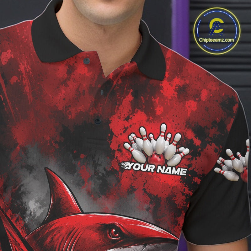 Red and black polo shirt with shark and bowling design, featuring a brand logo in the corner.
