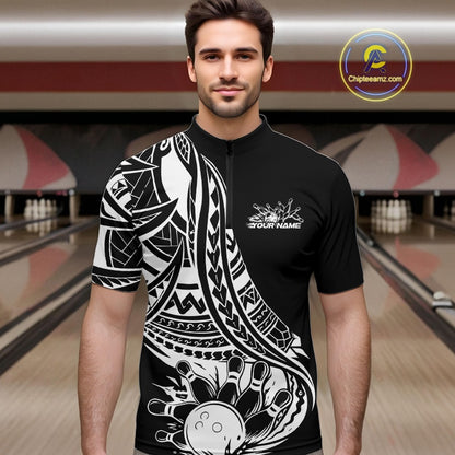 Man wearing a black and white tribal pattern bowling shirt with a design in a bowling alley.