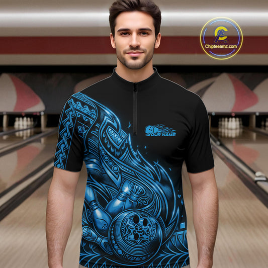Male model wearing a black and blue bowling quarter-zip shirt at the bowling lane with Polynesian-inspired flame bowling artwork.