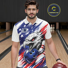 Load image into Gallery viewer, Man wearing a colorful polo shirt with an eagle and bowling ball design in a bowling alley.