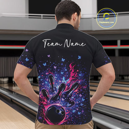Male model wearing a colorful bowling quarter-zip shirt at the lane with flaming bowling strike artwork and sparkling butterflies.