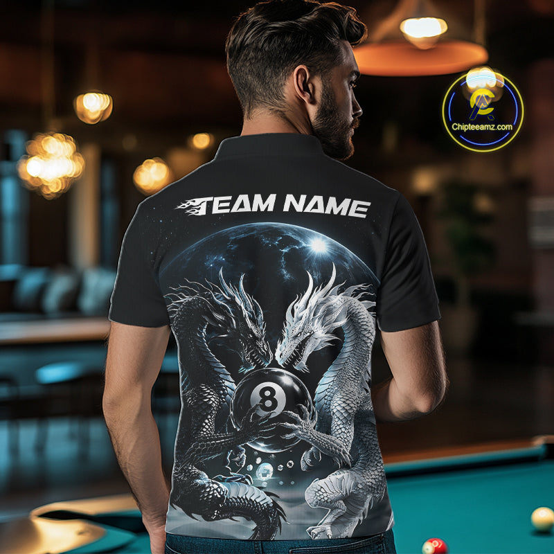 A man viewed from behind wearing a black billiard short-sleeve polo shirt with a large back graphic showing two silver-gray dragons around an 8-ball under a galaxy sky, with 'TEAM NAME' printed in white across the shoulders. 