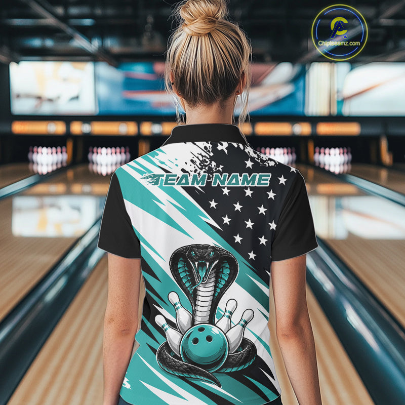 Back view of a woman in a bowling alley wearing a black, white, and blue american flag cobra-themed shirt with “Team Name” across the shoulders.