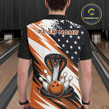 Load image into Gallery viewer, Back view of a man in a bowling alley wearing a black, white, and orange american flag cobra-themed shirt with “Team Name” across the shoulders.