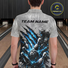 Load image into Gallery viewer, Back view of a male model wearing a gray bowling polo shirt showcasing a dramatic blue bowling ball and pins graphic with claw-mark artwork in a bowling lane.