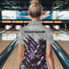 Load image into Gallery viewer, Back view of a female model wearing a gray bowling polo shirt showcasing a dramatic purple bowling ball and pins graphic with claw-mark artwork in a bowling lane.