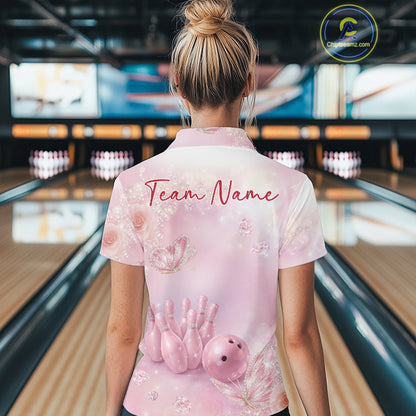 Back view of a female model wearing a women’s bowling quarter-zip shirt with pink glitter butterflies, diamonds, bowling pins, and a bowling ball motif.