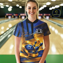 Load image into Gallery viewer, Front view of a female model wearing a bowling quarter zip shirt featuring a glossy blue bowling ball and pins wrapped in flowing gold ribbon accents at a bowling lane.