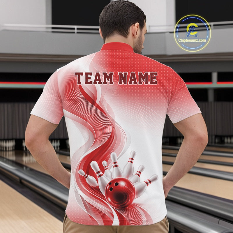 Male model wearing a white and red bowling quarter-zip shirt with sweeping wave artwork and a bowling ball knocking down pins