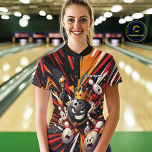 Load image into Gallery viewer, Front view of a female model wearing a black, red, and orange bowling quarter zip shirt featuring a crowned cartoon bowling ball holding a royal scepter with animated bowling pins and colorful burst graphics in a bowling lane.
