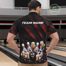 Load image into Gallery viewer, Male model shown from the front wearing a black and red bowling quarter zip shirt with festive cartoon bowling balls and pins celebrating with frothy beer mugs, confetti, and bold diagonal stripes at a bowling lane.