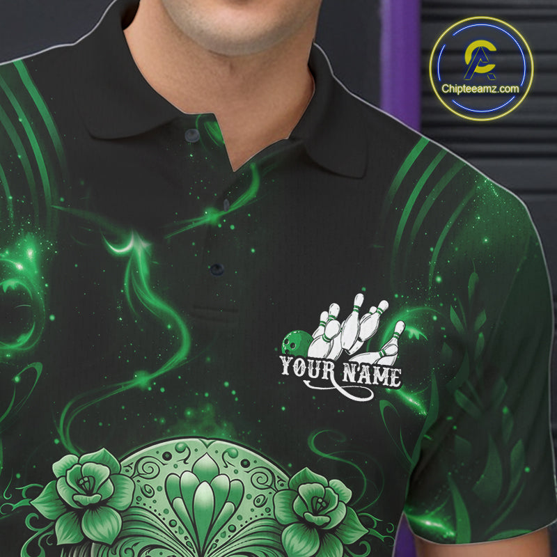 Close-up of a black and green bowling polo shirt left chest showing a floral sugar skull above a bowling ball and bowling pins design.