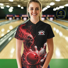 Load image into Gallery viewer, Front view of a female model in a bowling alley wearing a black bowling quarter zip shirt featuring a red fiery skull with lightning striking a bowling ball and pins and a custom name.
