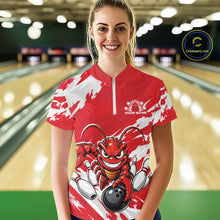 Load image into Gallery viewer, Front view of a happy female model in a bowling alley wearing a red custom quarter zip bowling shirt with an aggressive crawfish bowling design and a distressed background.