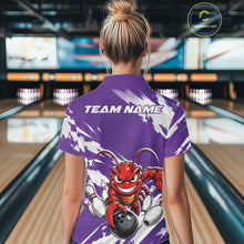 Load image into Gallery viewer, Back view of a female model in a bowling alley wearing a purple custom bowling polo shirt with an aggressive crawfish bowling design and a distressed background.