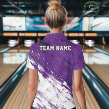 Load image into Gallery viewer, Back view of a female model in a bowling alley wearing a bowling quarter-zip shirt featuring a white paint splatter distressed sportswear design on a purple shirt.
