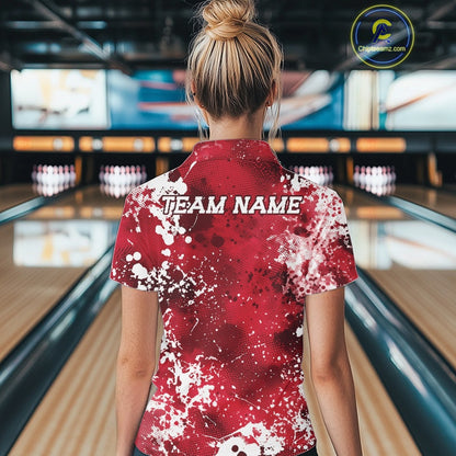 Person wearing a red and white 'TEAM NAME' shirt in a bowling alley.