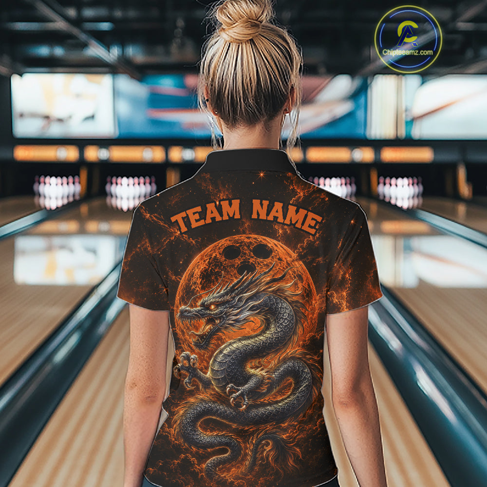 Back view of a female model in a bowling alley wearing an orange custom quarter-zip bowling shirt featuring an ancient dragon, flames, and a moon-inspired bowling ball design.