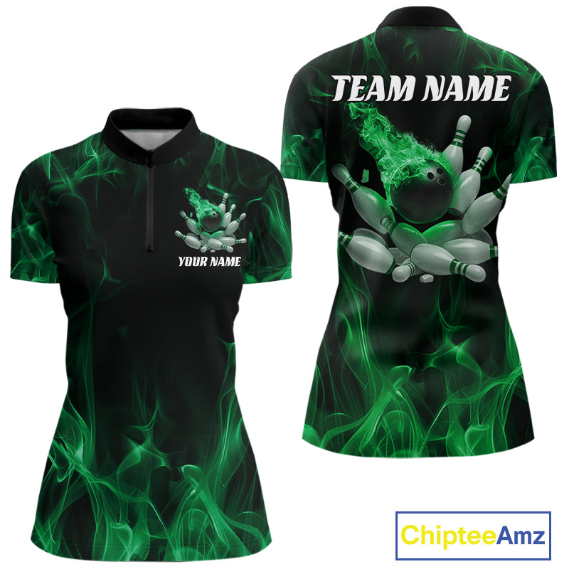 Front and back view of a black and green women’s bowling quarter-zip shirt featuring a bowling ball crashing into scattered pins with a fiery flame background.