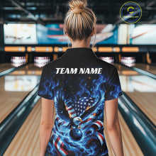 Load image into Gallery viewer, Female model back view in a bowling lane wearing a bowling quarter zip shirt with flaming eagle artwork, blue bowling ball, flag accents, and blue flames.