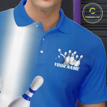 Load image into Gallery viewer, Left chest close up of a bowling polo shirt featuring bowling ball and pins graphics flowing through a blue gradient design.
