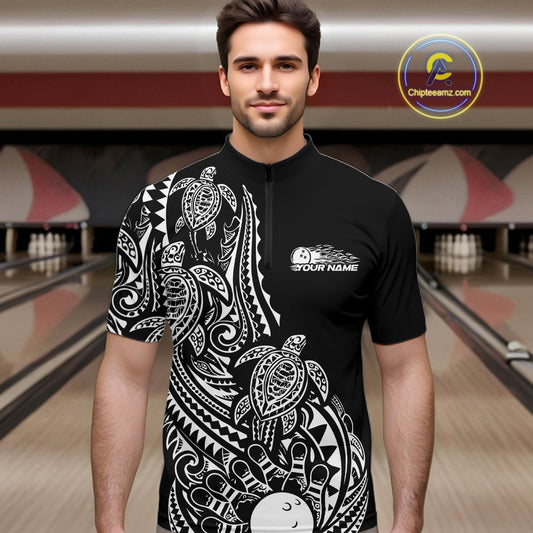 Male model wearing a black and white bowling quarter-zip shirt at the bowling lane with Polynesian-style bowling graphics.
