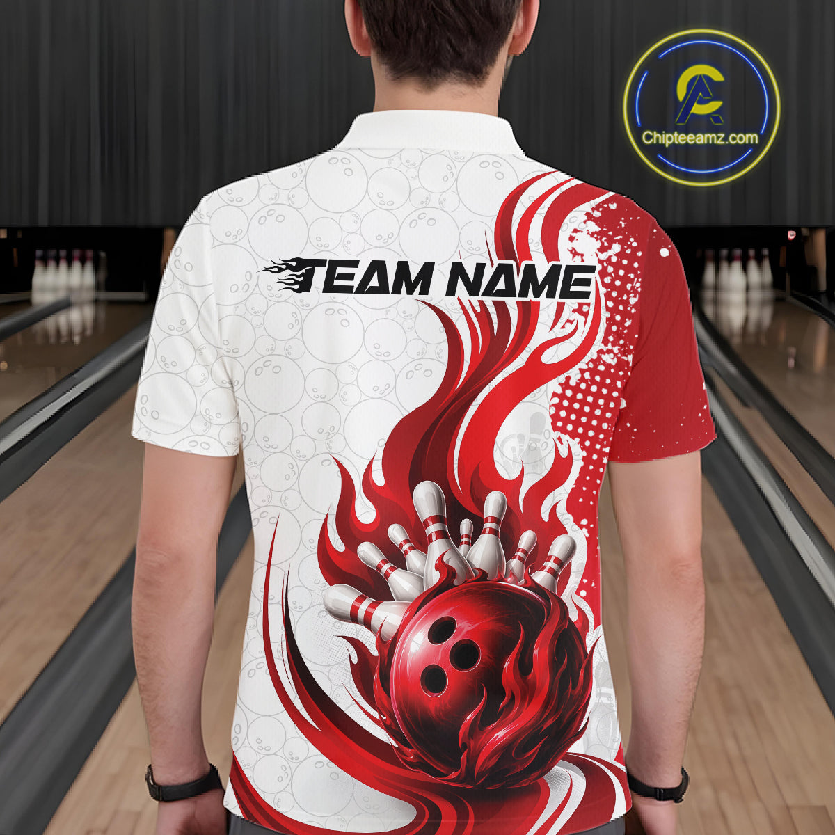 A man viewed from behind wearing a white and red bowling-themed short-sleeve polo shirt with a flame and bowling ball graphic, standing in a bowling alley.