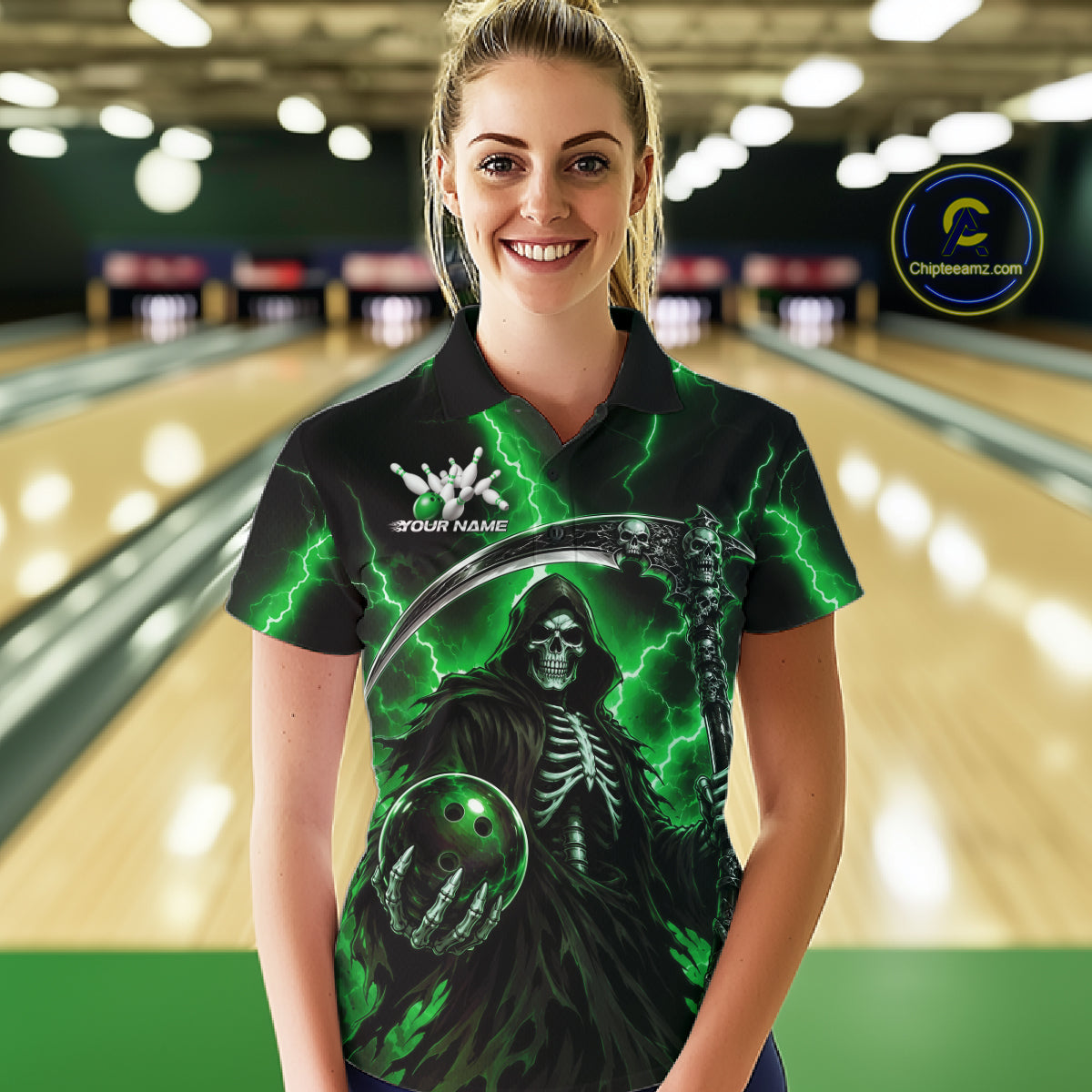 A woman wearing a custom black polo shirt with a green and gray grim reaper graphic, standing in a bowling alley with blurred lanes in the background. 