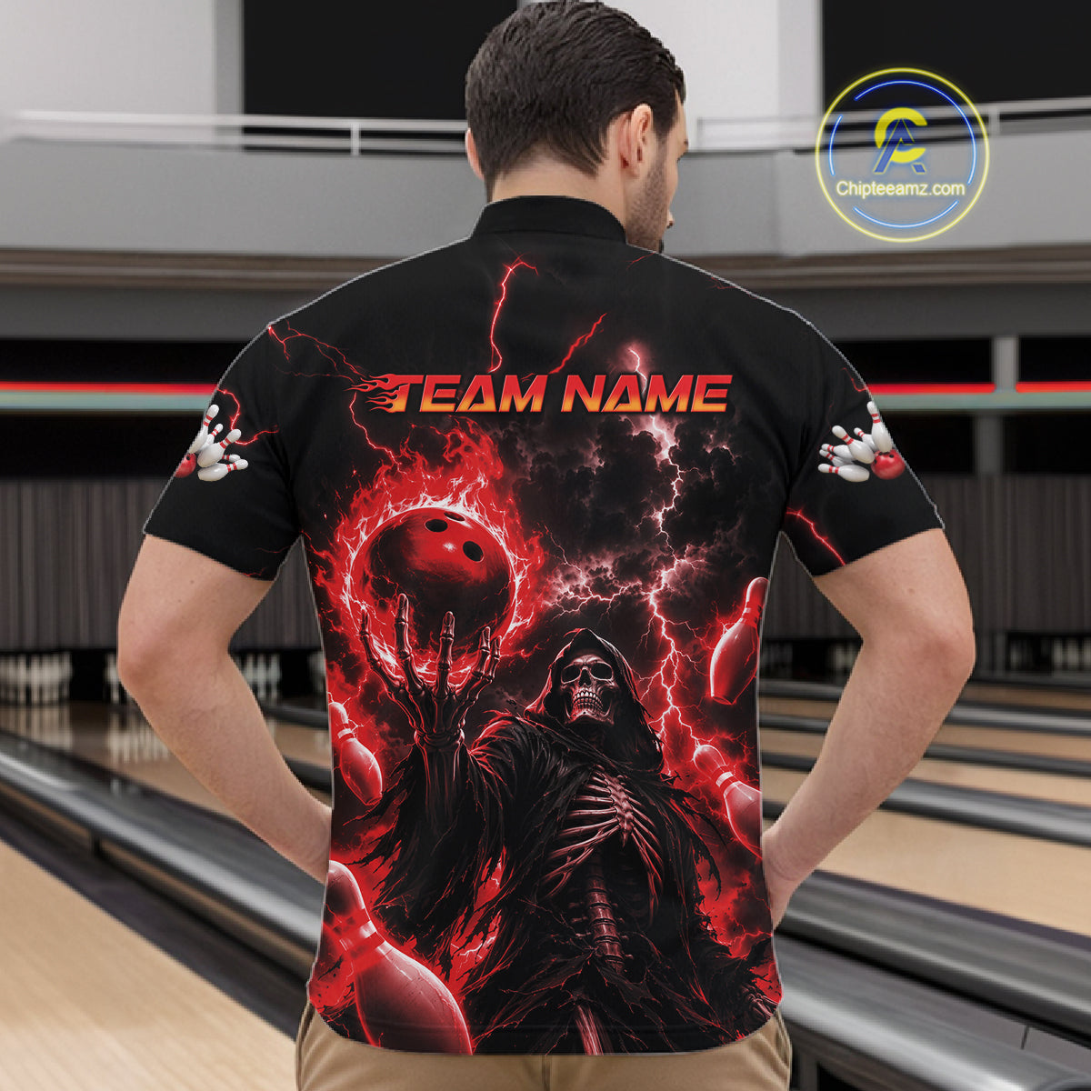 A man viewed from behind wearing a black short-sleeve bowling shirt with a large red and black graphic print featuring a hooded figure, bowling balls, lightning, and the text 'TEAM NAME' across the upper back. 