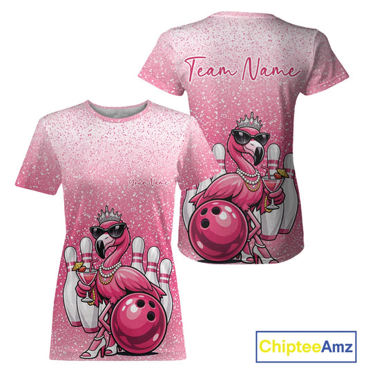 Front and back view of a pink women’s crewneck bowling T-shirt featuring a crowned flamingo holding a cocktail while leaning on a bowling ball.