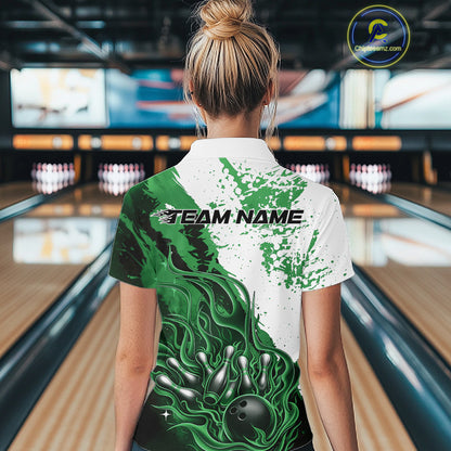 Back view of a female model in a bowling lane wearing a black, green and white flame bowling quarter-zip shirt featuring dynamic bowling strike artwork.