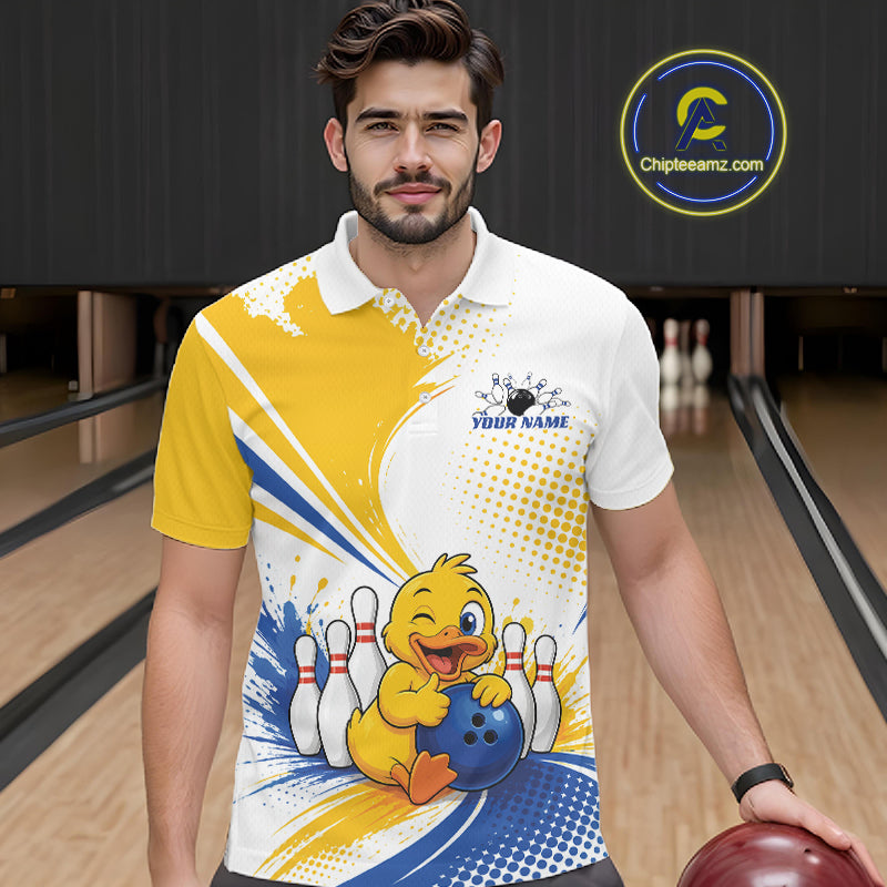 A man wearing a custom bowling-themed polo shirt with a cartoon duck holding a bowling ball, set against a bowling alley background. The shirt features a white base with yellow and blue graphic patterns and a custom name printed on the chest.