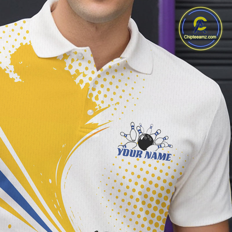 A close-up of a white short-sleeve polo shirt worn by a model, featuring a bold yellow abstract graphic on the left side, yellow halftone dots, blue and yellow diagonal stripes, and a customizable chest print with a bowling pin graphic and the text 'YOUR NAME'.