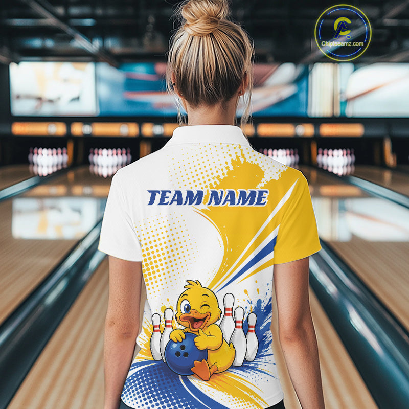 A woman viewed from behind wearing a customized bowling-themed short-sleeve polo shirt. The shirt features a white, yellow, and blue graphic design with a cartoon yellow duck holding a bowling ball and pins, and the text 'TEAM NAME' printed in blue.