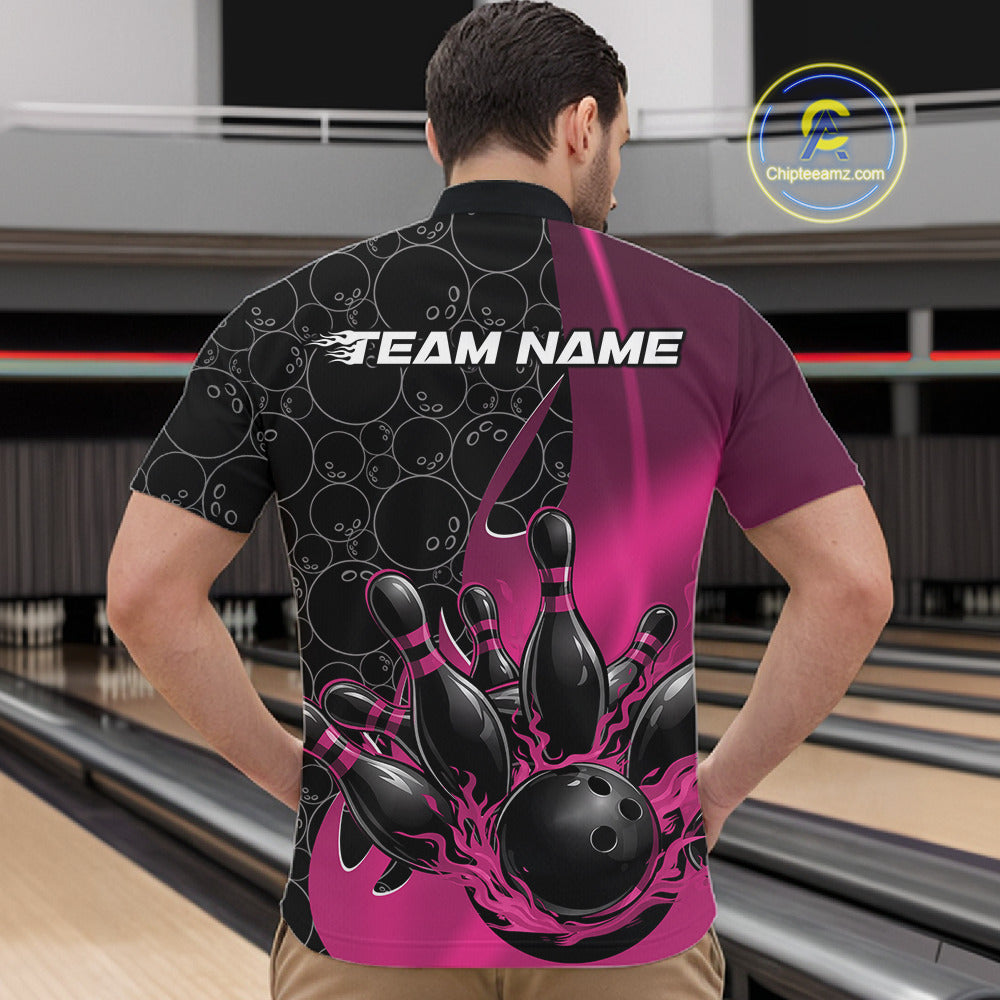 Male model in bowling alley front view wearing black and pink quarter zip shirt featuring flaming black bowling ball graphic with bowling pin impact design