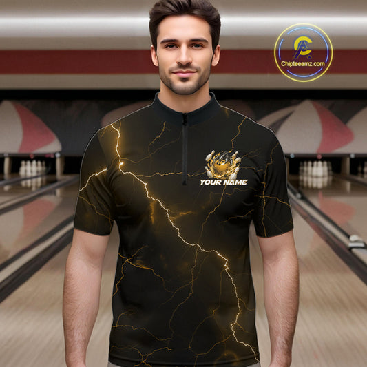Male model wearing a black and yellow bowling quarter-zip with dragon claw artwork, flaming bowling ball, and lightning fantasy background.