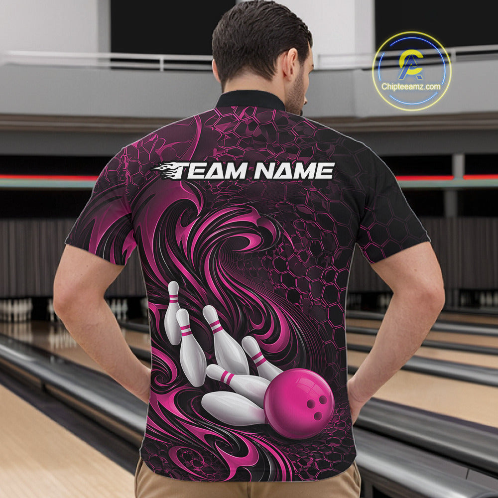 Male model standing in a bowling lane wearing a black and pink bowling quarter-zip shirt featuring a tribal flame bowling ball and pins graphic on the front.