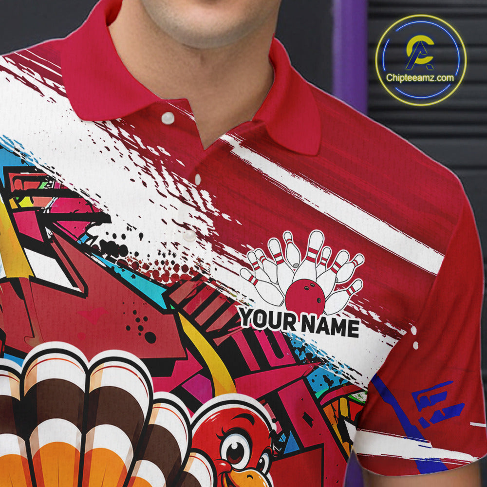 Close up front view of the left chest area on a red custom bowling polo shirt, featuring a graffiti inspired urban street style design with paint splatter accents and a personalized name.