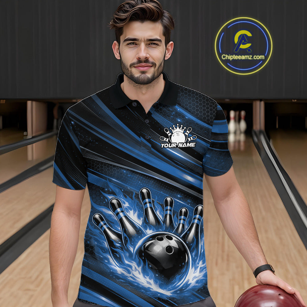Male model at a bowling lane wearing a black and blue bowling polo shirt with fiery bowling action artwork and bold stripe accents.