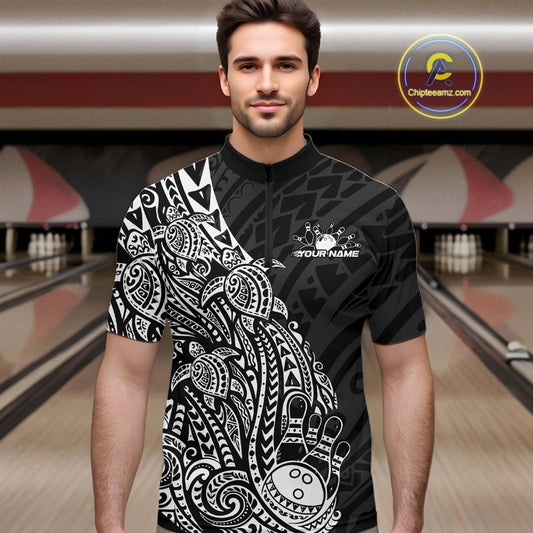 Male model wearing a black and white bowling quarter-zip shirt at the bowling lane with turtle-inspired bowling artwork.