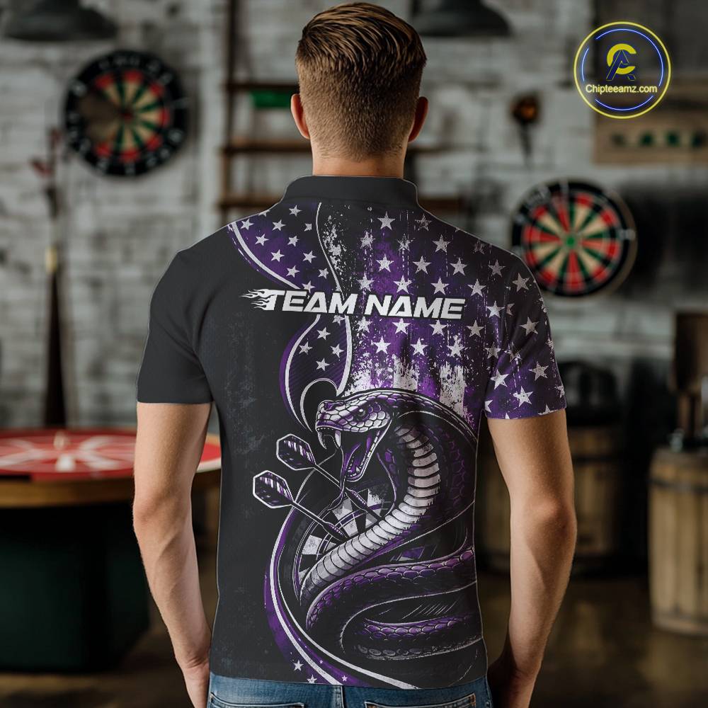 Male model showcasing the back design of a custom purple and black stars and stripes patriotic cobra snake men's dart polo shirt with a customizable "TEAM NAME" text template in an indoor setting.