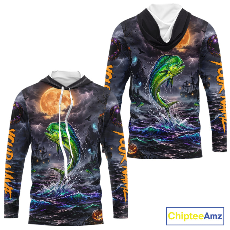 A long-sleeve hooded sweatshirt shown from the front and back, featuring an all-over Halloween-themed graphic print with a green fish jumping from dark ocean waves under a full moon, plus orange text down the sleeves. The hoodie has a black hood and white drawstrings.